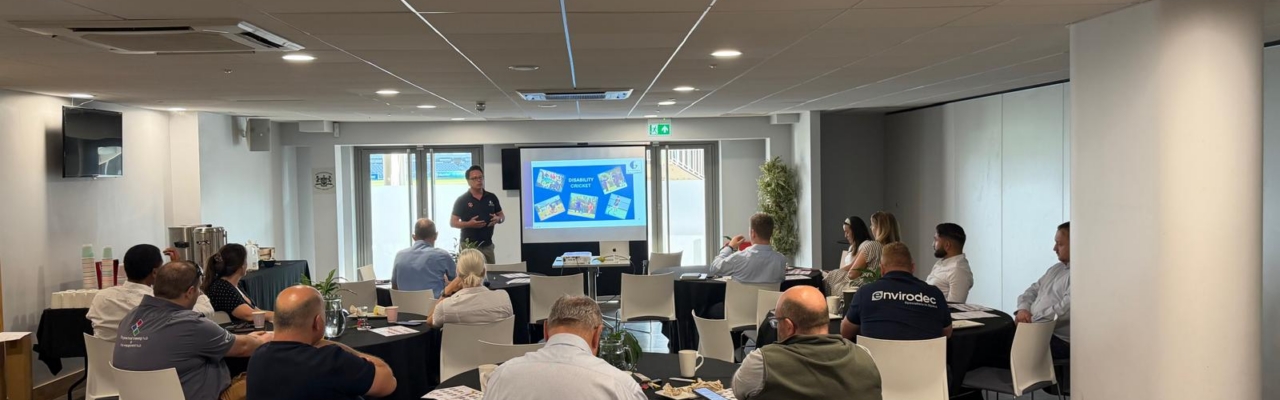 Crispin from Gloucester Cricket Foundation presenting to members at a Synergy Networking meeting about disability cricket and community initiatives.